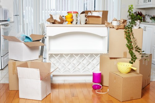 Packed boxes and furniture ready for a flat move in Elephant and Castle