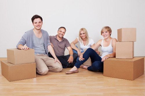 Local movers organising boxes for an Elephant and Castle apartment